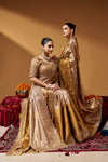 Two-model editorial view featuring embellished Kanjivaram zari tissue sarees.