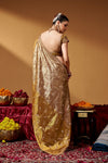 Back view showing the blouse design and saree drape.