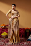 Back view of the saree drape with decorative work.