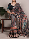 Main product view of a printed Tasar Silk Saree with a viscose border, draped on a model.