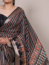 Printed Tasar Silk Saree with geometric motifs and a contrasting decorative border.